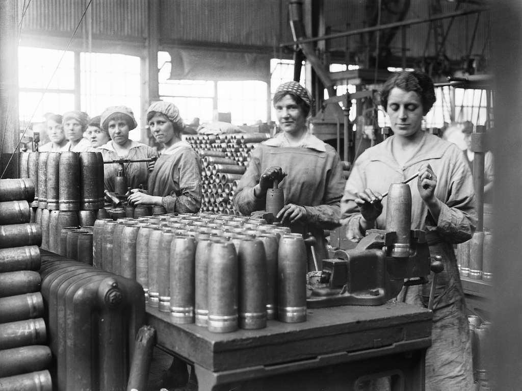 Women war workers tap shells at the Royal Shell Factory, Woolwich Arsenal, 1918.