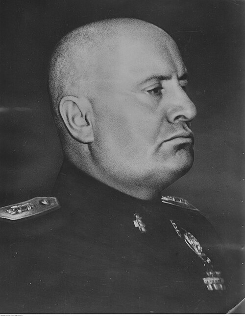 A portrait of the Italian Fascist leader Benito Mussolini in uniform.