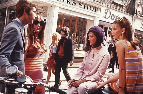 A 1966 street sign and shops on Carnaby Street, a fashionable part of 1960s London.